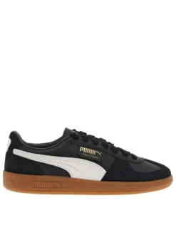 Tennis en cuir noires à semelle marron avec lacets plats et logo blanc et doré