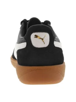 Tennis en cuir noires à semelle marron avec lacets plats et logo blanc et doré