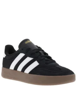 Tennis noires en croûte de cuir avec semelle à talon plat et à lacets