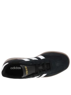 Tennis noires en croûte de cuir avec semelle à talon plat et à lacets