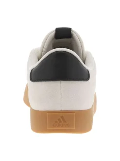 Tennis noires et beiges à talon plat avec des lacets blancs larges