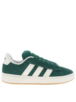 Tennis vertes et blanches à talon plat avec des lacets larges