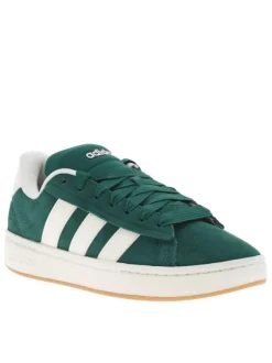 Tennis vertes et blanches à talon plat avec des lacets larges