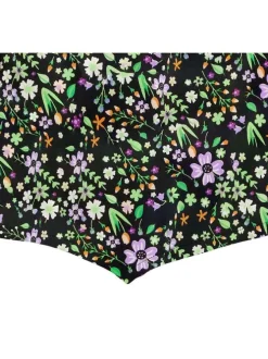 Top asymétrique noir fleuri avec une coupe cropped et un col v