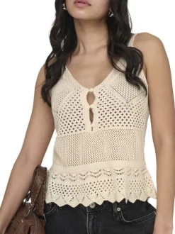 Top beige uni sans manche pourvu d'une coupe évasée et d'un col v