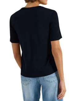 Top bleu marine uni avec une coupe droite et un col tunisien