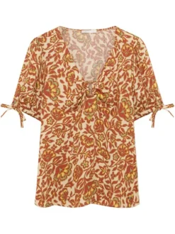 Top brique avec des motifs fleuris à coupe droite avec un col v