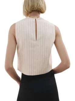Top écru à rayures avec une coupe cropped et un bijou au col