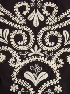 Top en coton black uni pourvu d'une coupe droite et d'un col rond