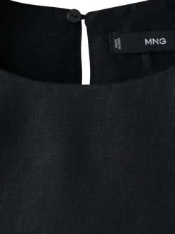Top en coton noir uni avec un col rond et une fermeture boutonnée