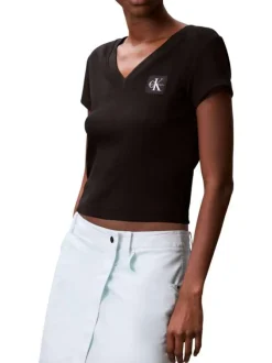 Top en coton noir uni à col v et à coupe courte avec un patch à la poitrine
