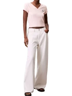 Top en coton rose uni à col v et à coupe courte avec un patch à la poitrine