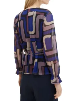 Top multicolore imprimé avec une coupe ample un col v et des manches longues