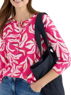 Top rose à motifs pourvu d'un col v à nouer et d'une coupe droite