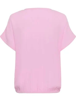 Top rose uni pourvu d'une coupe ample et de manches courtes