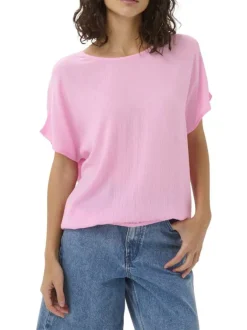Top rose uni pourvu d'une coupe ample et de manches courtes