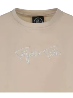 T-shirt beige uni avec une coupe droite à col rond et liseré
