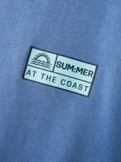 T-shirt en coton biologique bleu effet légèrement délavé avec un col rond
