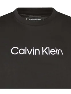 T-shirt en coton noir uni avec une coupe droite, un col rond et nom de la marque