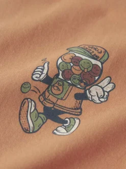 T-shirt en coton peche uni pourvu d'un col rond et d'un imprimé