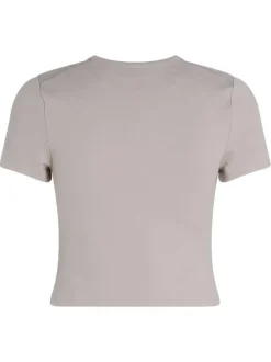 T-shirt beige uni avec une coupe crop top près du corps et un col rond