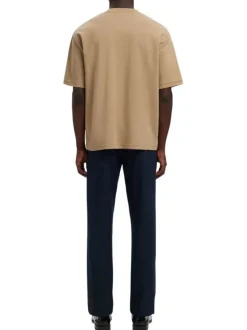T-shirt beige uni coupe ample avec un col rond et des manches courtes