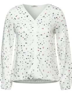 T-shirt blanc fleuri avec une coupe droite col rond et à manches courtes