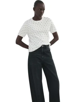 T-shirt blanc à motifs pourvu de manches courtes et d'un col rond