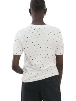 T-shirt blanc à motifs pourvu de manches courtes et d'un col rond
