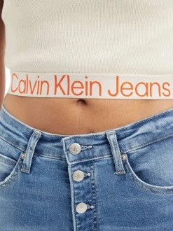 T-shirt cropped en coton écru à col rond avec logo orange sur l'ourlet inférieur