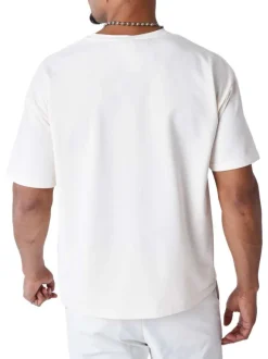 T-shirt écru uni à coupe oversize avec un cœur brodé à la poitrine