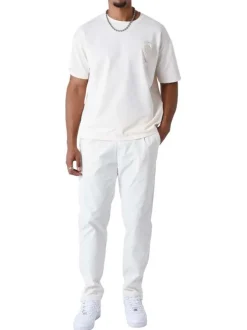 T-shirt écru uni à coupe oversize avec un cœur brodé à la poitrine