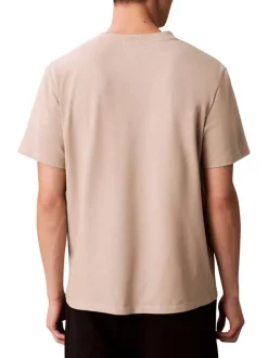 T-shirt en coton beige à coupe droite pourvu d'un col rond ras de cou