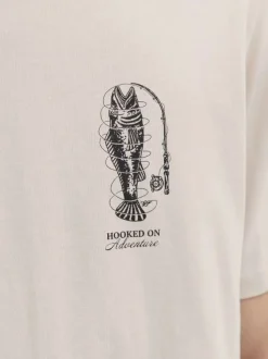 T-shirt en coton beige imprimé avec une coupe droite et un col rond