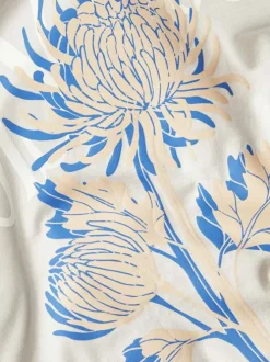 T-shirt en coton beige imprimé floral avec une coupe ample et col rond