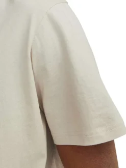 T-shirt en coton beige uni avec une coupe droite et un col rond