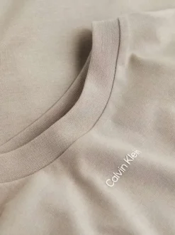 T-shirt en coton beige uni avec une coupe oversize et un col rond