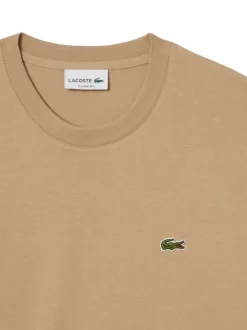 T-shirt en coton beige uni à col rond avec le petit logo brodé