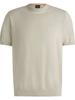 T-shirt en coton beige uni en maille avec une coupe oversize et un col rond
