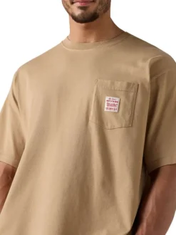 T-shirt en coton beige uni pourvu d'un col rond et de manches courtes