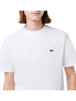 T-shirt en coton blanc uni avec une coupe droite et un col rond