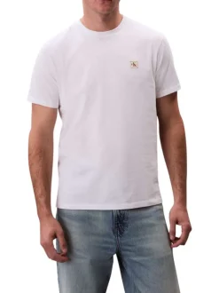 T-shirt en coton blanc uni avec un petit patch brodé et à col rond
