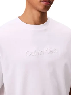 T-shirt en coton blanc uni à coupe oversize avec le nom de la marque brodé