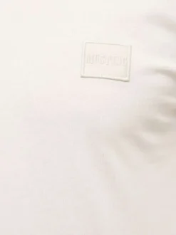 T-shirt en coton blanc uni pourvu d'un col rond et de manches courtes