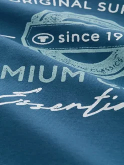T-shirt en coton bleu imprimé avec une coupe droite et un col rond