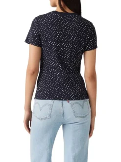 T-shirt en coton bleu marine à pois avec une coupe près du corps et un col rond