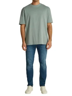 T-shirt en coton bleu uni à coupe oversize avec une écriture gaufrée à l'arrière