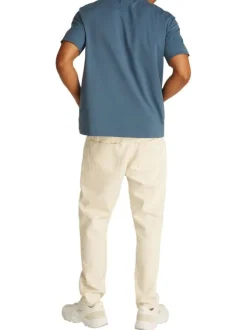 T-shirt en coton bleu uni à coupe oversize avec un patch logo cousu à l'avant