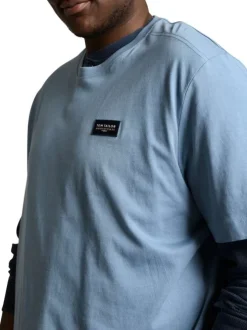 T-shirt en coton bleu uni pourvu d'une coupe droite et d'un col rond
