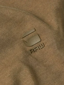 T-shirt en coton brun uni avec logo iconique sur la poitrine et un col rond